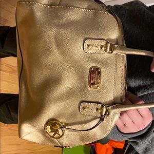Michael Kors gold purse lightly used